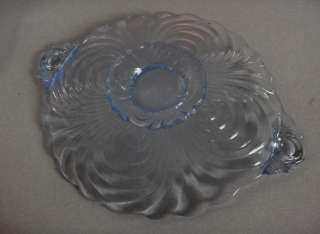 Up for sale is a beautiful ice blue Depression glass handled footed 