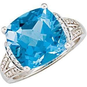  Expressive Swiss Blue Topaz & Diamond Ring set in 14 karat 