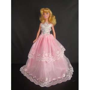  A Soft Pink Strapless Ball Gown with a Large Flower on the 