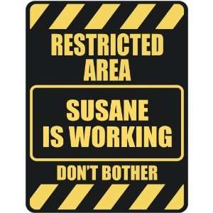   RESTRICTED AREA SUSANE IS WORKING  PARKING SIGN