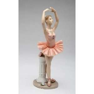   Dancing Next to White Stand in Peach Dress Figurine